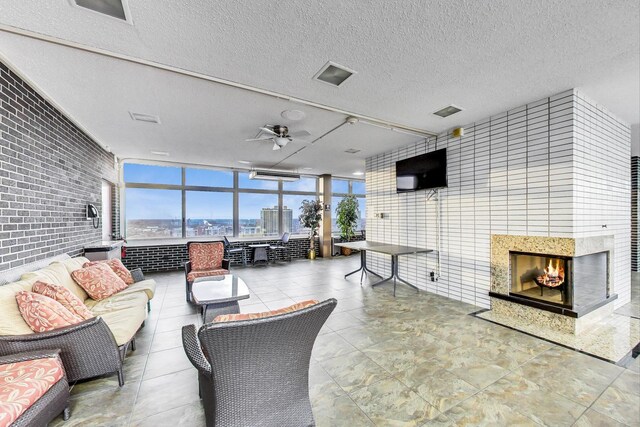interior space featuring a ceiling fan and an outdoor hangout area