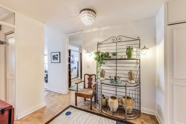 dining area with baseboards and a chandelier