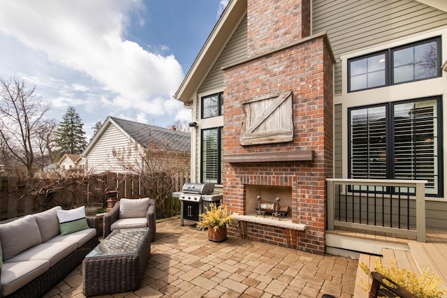 4529 Washington St, Downers Grove, IL 60515 - view of patio with a grill, an outdoor living space with a fireplace, and fence