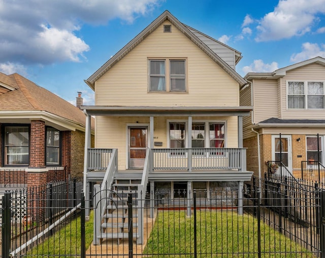 1913 N Kildare Ave, Chicago, IL 60639 - view of front of home featuring a front yard, a fenced front yard, a porch, and stairway
