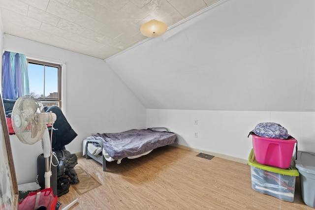 1913 N Kildare Ave, Chicago, IL 60639 - bedroom featuring baseboards, lofted ceiling, and wood finished floors