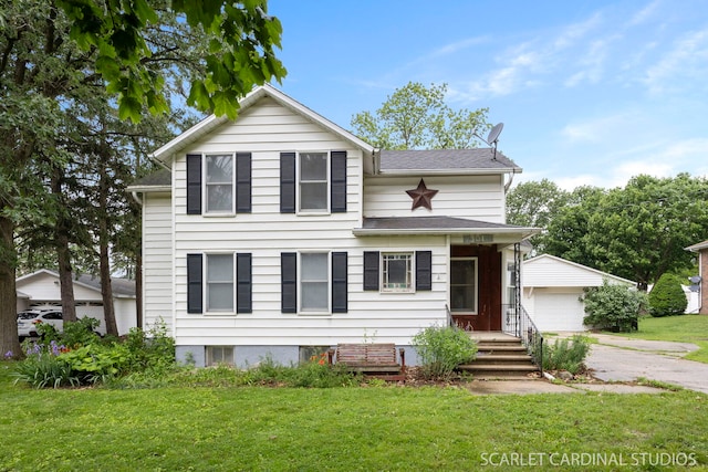 301 S Shabbona Rd, Shabbona, IL 60550 - traditional-style house with an outdoor structure, a front yard, a garage, and a shingled roof
