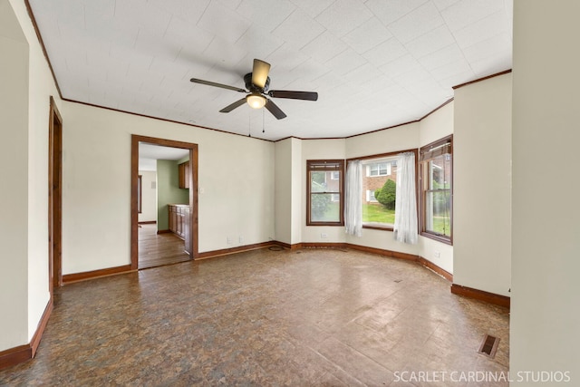 301 S Shabbona Rd, Shabbona, IL 60550 - unfurnished room with baseboards, ornamental molding, and a ceiling fan