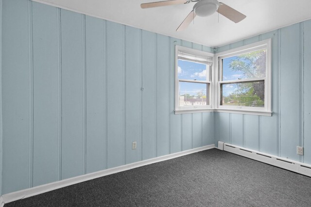 18241 Roy St, Lansing, IL 60438 - carpeted empty room featuring a decorative wall, a ceiling fan, and a baseboard heating unit