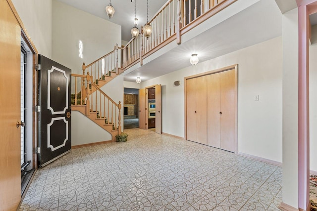 7415 W Ute Ln, Palos Heights, IL 60463 - foyer entrance featuring stairway and a towering ceiling