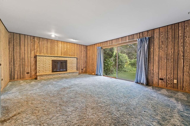 7415 W Ute Ln, Palos Heights, IL 60463 - unfurnished living room with wood walls, carpet floors, and a fireplace
