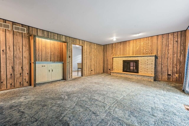 7415 W Ute Ln, Palos Heights, IL 60463 - unfurnished living room with carpet floors, a fireplace, and wood walls