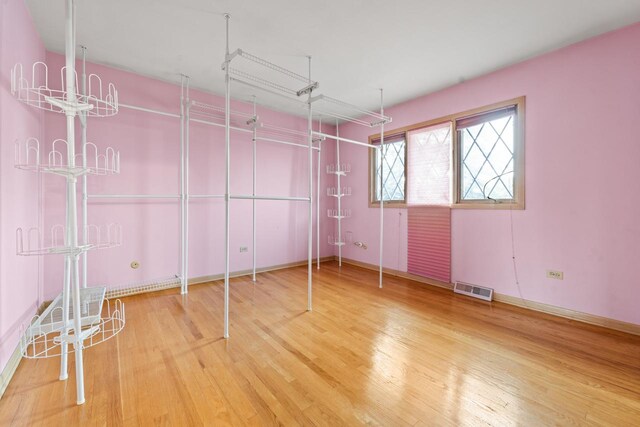 7415 W Ute Ln, Palos Heights, IL 60463 - unfurnished bedroom with wood finished floors