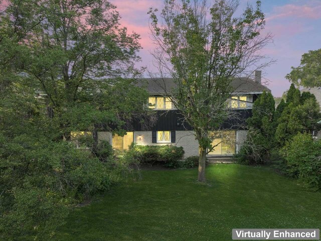 7415 W Ute Ln, Palos Heights, IL 60463 - back of property at dusk featuring a lawn