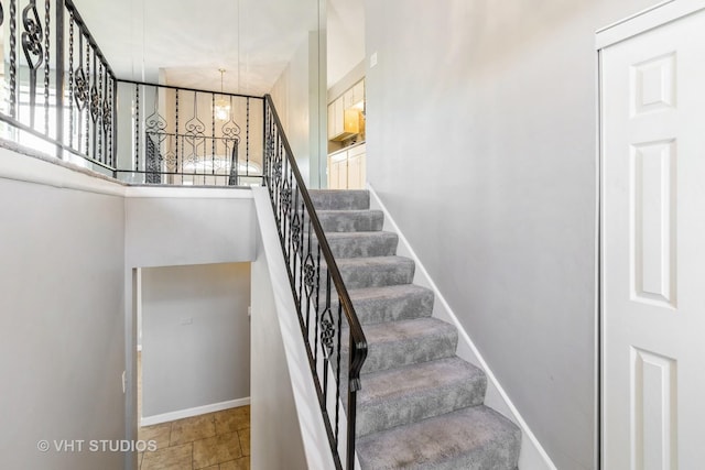 1437 S Busse Rd, Mount Prospect, IL 60056 - staircase with baseboards and a high ceiling