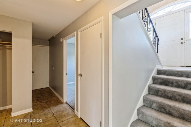 1437 S Busse Rd, Mount Prospect, IL 60056 - stairway featuring tile patterned flooring and baseboards