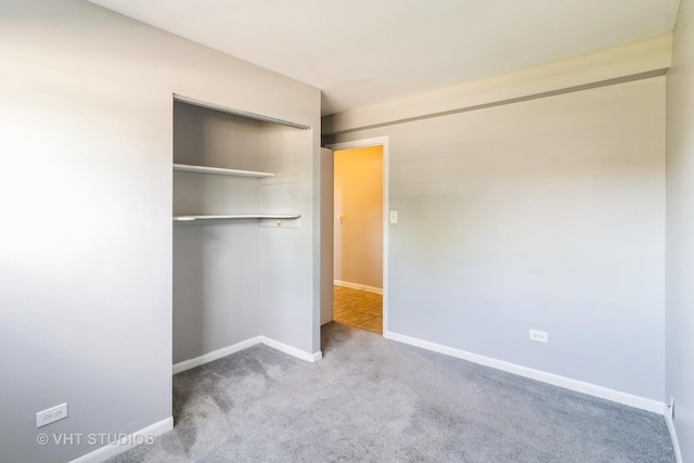 1437 S Busse Rd, Mount Prospect, IL 60056 - unfurnished bedroom with a closet, carpet floors, and baseboards