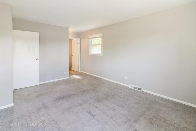 1437 S Busse Rd, Mount Prospect, IL 60056 - carpeted empty room featuring baseboards