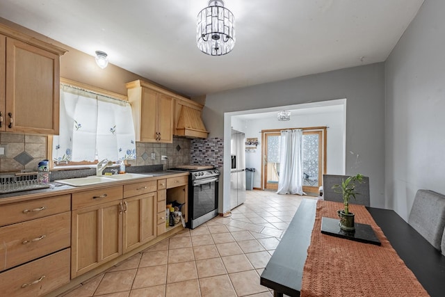 3801 W 65th Pl, Chicago, IL 60629 - kitchen featuring appliances with stainless steel finishes, decorative backsplash, a sink, a chandelier, and light tile patterned floors