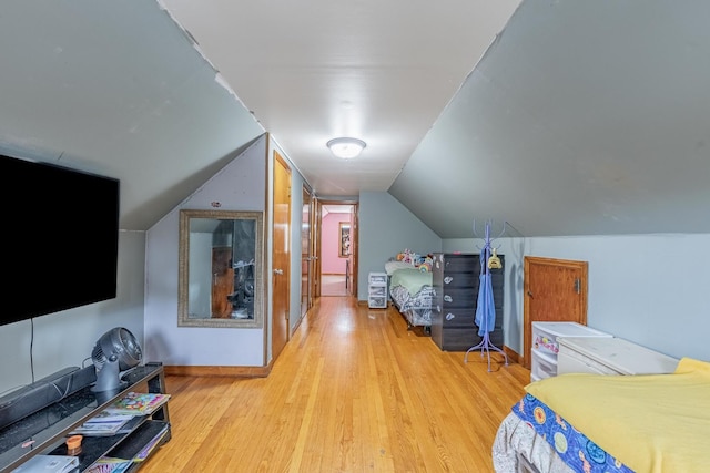 3801 W 65th Pl, Chicago, IL 60629 - bedroom featuring wood finished floors, lofted ceiling, and baseboards