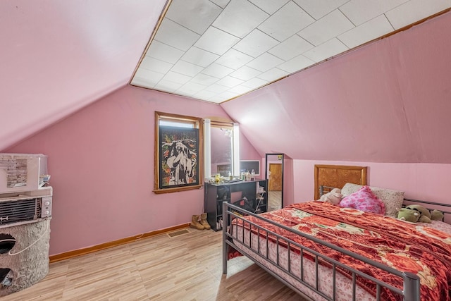 3801 W 65th Pl, Chicago, IL 60629 - bedroom with wood finished floors, vaulted ceiling, and baseboards