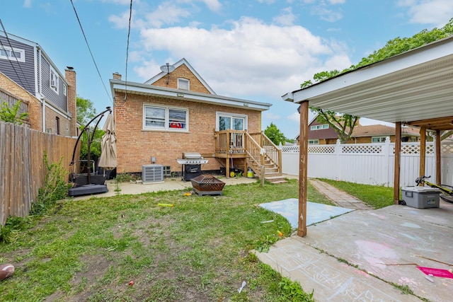 3801 W 65th Pl, Chicago, IL 60629 - rear view of house with a patio, a fire pit, brick siding, and central air condition unit