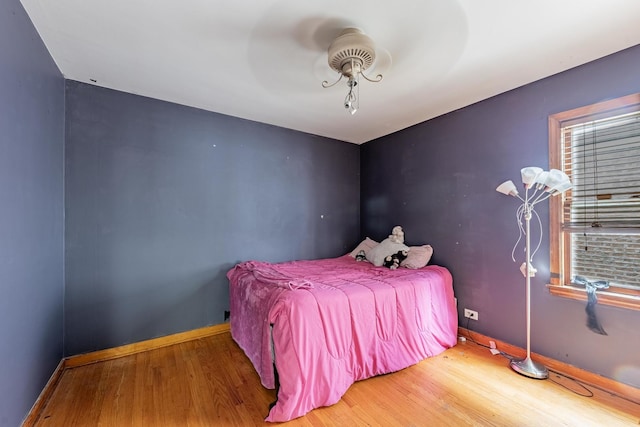 3801 W 65th Pl, Chicago, IL 60629 - bedroom featuring wood finished floors, baseboards, and multiple windows