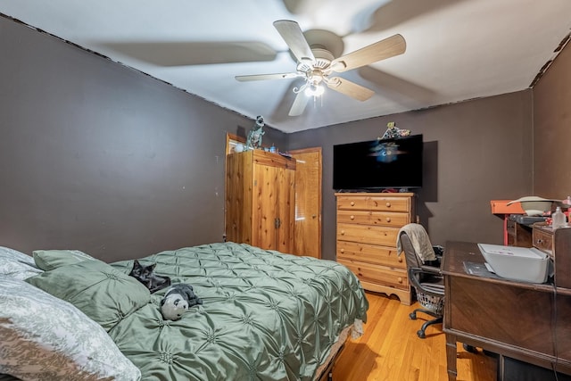3801 W 65th Pl, Chicago, IL 60629 - bedroom featuring light wood finished floors, ceiling fan, and an office area