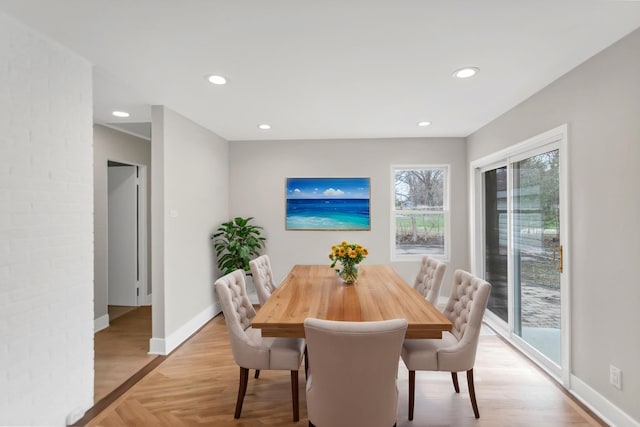 dining space with recessed lighting, light wood finished floors, and baseboards