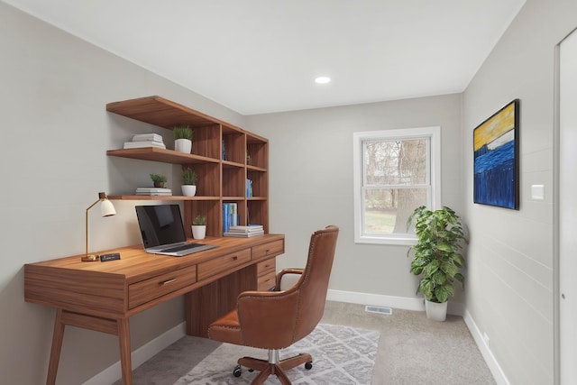 office space with visible vents, baseboards, recessed lighting, and light carpet