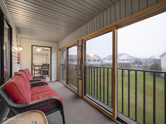 sunroom featuring carpet floors