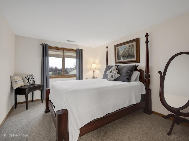 bedroom featuring baseboards, visible vents, and light colored carpet