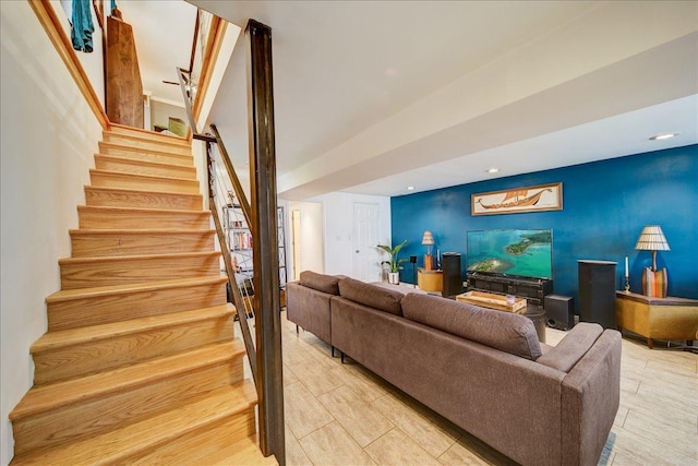 living room featuring recessed lighting and stairs