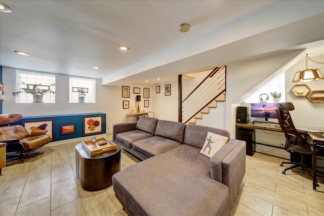 living room featuring recessed lighting and stairs