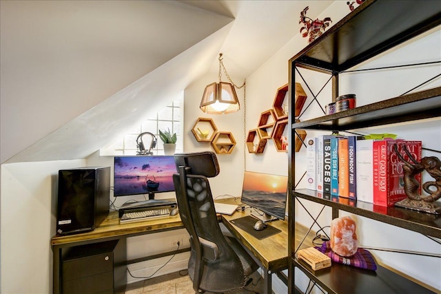 home office featuring tile patterned floors and lofted ceiling