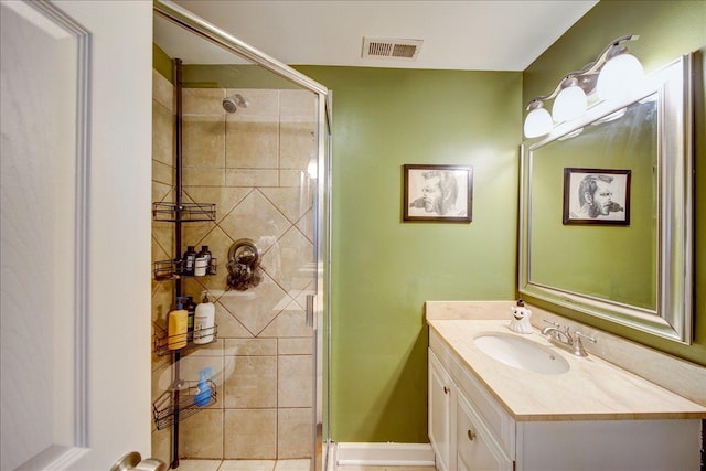 full bathroom with visible vents, a shower stall, and vanity