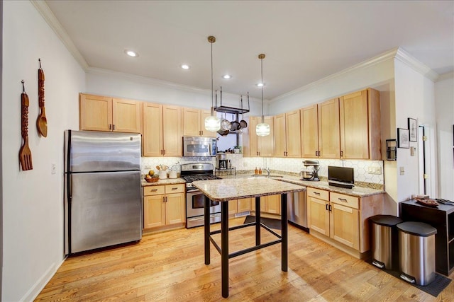 kitchen with stainless steel appliances, ornamental molding, light brown cabinets, and a sink