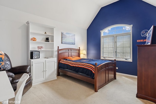 bedroom featuring vaulted ceiling and light colored carpet