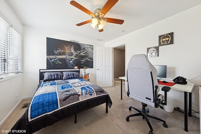 bedroom featuring baseboards, a ceiling fan, visible vents, and carpet