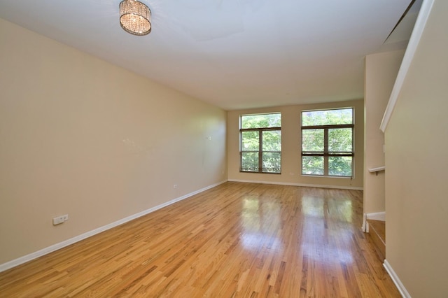 353 E Eastgate Pl, Chicago, IL 60616 - unfurnished room with baseboards and light wood-type flooring