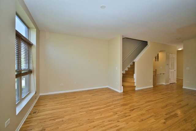 353 E Eastgate Pl, Chicago, IL 60616 - unfurnished room with healthy amount of natural light, light wood-type flooring, and stairway