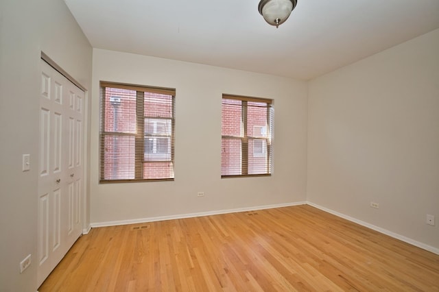 353 E Eastgate Pl, Chicago, IL 60616 - unfurnished bedroom featuring light wood-style floors and a closet