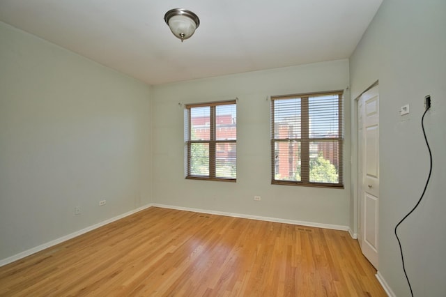 353 E Eastgate Pl, Chicago, IL 60616 - unfurnished room with light wood-style floors and baseboards
