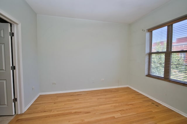 353 E Eastgate Pl, Chicago, IL 60616 - empty room with light wood-style floors and baseboards