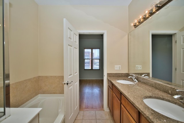 353 E Eastgate Pl, Chicago, IL 60616 - bathroom with double vanity, a bath, and tile patterned floors