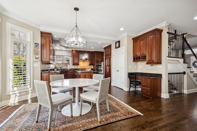 dining room with baseboards, an inviting chandelier, ornamental molding, stairway, and dark wood-type flooring