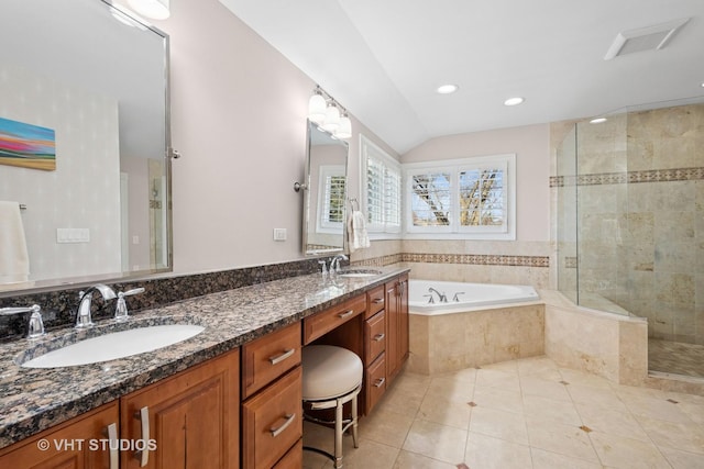 bathroom with a sink, tile patterned flooring, a stall shower, and a garden tub