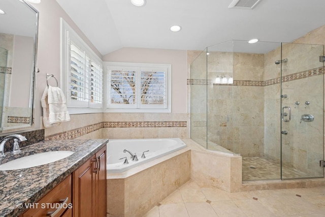 full bath with a shower stall, vanity, vaulted ceiling, tile patterned floors, and a garden tub