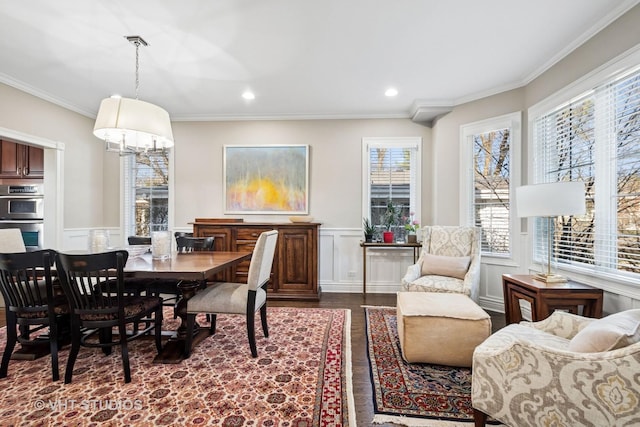 dining room featuring recessed lighting, wainscoting, ornamental molding, and dark wood finished floors