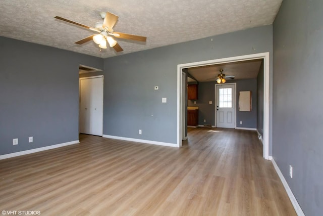 1105 Eileen St, Coal City, IL 60416 - unfurnished room featuring ceiling fan, wood finished floors, a textured ceiling, and baseboards