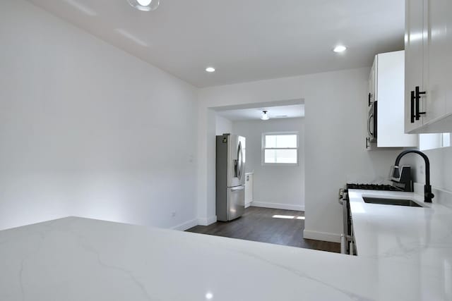1405 S Central Ave, Cicero, IL 60804 - kitchen with light stone countertops, dark wood-style floors, stainless steel refrigerator with ice dispenser, white cabinets, and recessed lighting
