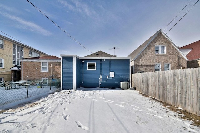 1405 S Central Ave, Cicero, IL 60804 - snow covered rear of property featuring cooling unit and fence