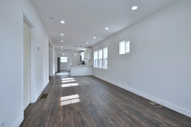 1405 S Central Ave, Cicero, IL 60804 - unfurnished living room featuring baseboards, visible vents, recessed lighting, and dark wood finished floors