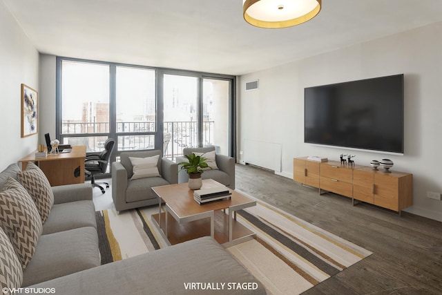 1636 N Wells St Unit 609, Chicago, IL 60614 - living area with wood finished floors, expansive windows, and a desk