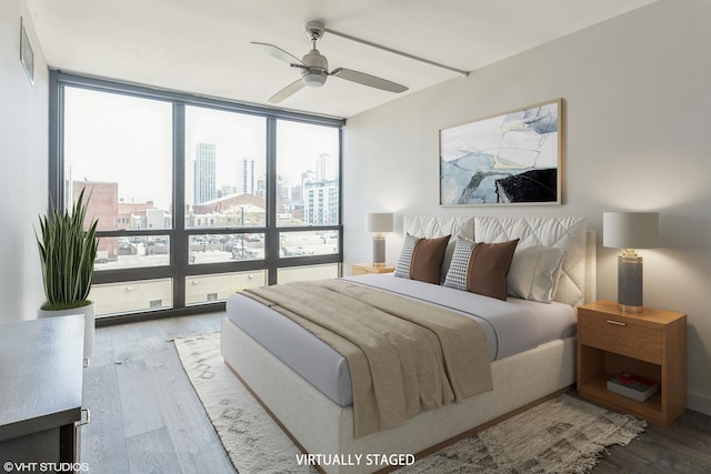 1636 N Wells St Unit 609, Chicago, IL 60614 - bedroom featuring floor to ceiling windows, a city view, wood finished floors, and a ceiling fan